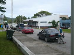 Alofi locals walking along a street.