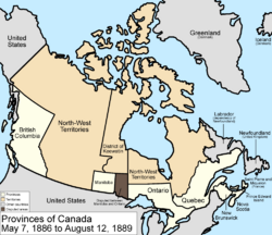 Map of the country of Canada on May 7, 1886, depicting the larger postage stamp sized province of Manitoba along with the provinces of Ontario northern border extended to the 51st parallel north, Prince Edward Island, Quebec (southern portion only), New Brunswick, British Columbia and Nova Scotia, in the colour white. The disputed area between Manitoba and Ontario is coloured black. Provinces are coloured white. The North-West Territories is separate from the slightly smaller District of Keewatin north of Manitoba.  Territories are depicted in the colour pink; additionally now the northern arctic islands are a part of the NWT.  The District of Keewatin now has a geographically shaped border to encompass the eastern borders of the newly formed provisional districts of the NWT.  The area called Newfoundland, Labrador, and Alaska are depicted in bluish grey colour, and are not a part of Canada.