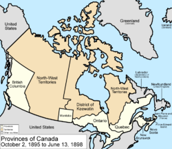 Map of the country of Canada on October 2, 1895, depicting the larger postage stamp sized province of Manitoba along with the provinces of Ontario, Prince Edward Island, Quebec (southern portion only), New Brunswick, British Columbia and Nova Scotia, in the colour white. The disputed area between Manitoba and Ontario is resolved, Ontario expands west to the Lake of the Woods and north to the Albany River. The Northwest Territories is separate from the District of Keewatin north, and territories are depicted in the colour pink; additionally now the northern arctic islands are a part of the NWT.  The District of Keewatin now has a geographically shaped border to encompass the eastern borders of the newly formed provisional districts of the NWT. The area called Newfoundland, Labrador, and Alaska are depicted in bluish grey colour, and are not a part of Canada.