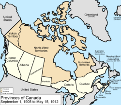 Map of the country of Canada on September 1, 1905, depicting the larger postage stamp sized province of Manitoba along with the provinces of Ontario, Prince Edward Island, Quebec, New Brunswick, British Columbia and Nova Scotia, in the colour white. The disputed area between Manitoba and Ontario is resolved, Ontario expands west to the Lake of the Woods and north to the Albany River. Alberta and Saskatchewan provinces are added from land formerly the NWT. Provinces are coloured white. The North-West Territories is separate from the District of Keewatin north of Manitoba.  Territories are depicted in the colour pink; the northern arctic islands are a part of the NWT.  The District of Keewatin now has a geographically shaped border to encompass the eastern borders of the newly formed provisional districts of the NWT. Yukon Territory is now formed from the NWT, and is expanded.  The area called Newfoundland, Labrador, and Alaska are depicted in bluish grey colour, and are not a part of Canada.