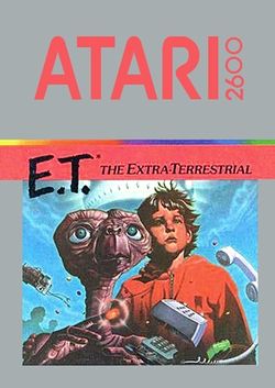 Artwork of a grey, vertical rectangular box. The top half reads "Atari 2600. E.T.* The Extra-Terrestrial". The bottom half displays a drawn image of an brown alien with a large head and long neck beside a young boy in a red, hooded jacket.