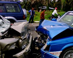 The front ends of two cars smashed together