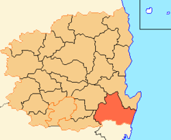 A region on an east coast is divided into 23 districts, with the southern coastal district highlighted.