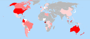 World map showing countries in gray, white and in various shades of red. The U.S. and Australia stand out as bright red (which the caption identifies as the 60–80% color). Brazil and Canada are medium pink (40–60%). China, much of western Europe, and central Africa are light pink (1–20%). Germany, Japan, Nigeria, and Venezuela are white (<1%).