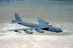 Picture of a B-52H flying over the desert