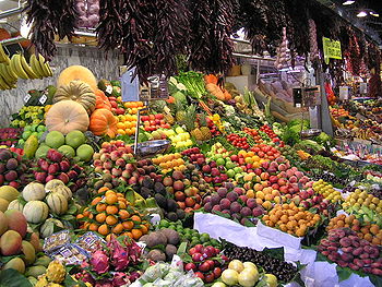  Fruit and vegetables on display at a market.