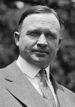 Upper-body portrait of an early-twentieth-century man in a suit.