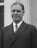 Upper-body portrait of an early-twentieth-century man in a suit.