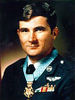 A color image of Levitow wearing his dress military uniform with ribbons and no hat. His Medal of Honor can be seen around his neck.