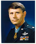 A color image showing the head and upper torso of Thorsness wearing his military dress uniform with ribbons. His Medal of Honor can be seen around his neck.