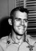 A black and white photo of Humbert Versace wearing his military uniform . Two military badges are clearly visible on the left breast pocket.