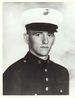 A black and white photo of Newlin from the waist up in his military dress blue uniform with hat.