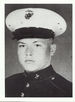 A black and white headshot of Paul facing slightly to the left and wearing his military dress blue uniform with hat.