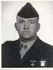 A black and white image showing the head and upper torso of Taylor in his military dress uniform with ribbons and hat.