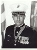 A black and white photo of the upper torso of Jay Vargas wearing his military dres uniform with hat and medals