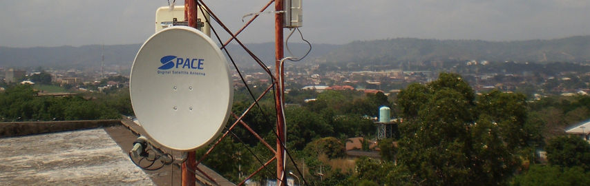 An image of the landscape of Enugu viewed from atop a building with hills in the background.