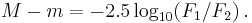 \ M - m = - 2.5 \log_{10}(F_1/F_2) \,.