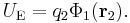 U_\mathrm{E} = q_2 \Phi_1(\mathbf r_2).