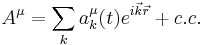 A^\mu= \sum_k a_k^\mu(t)e^{i\vec k\vec r} %2Bc.c.