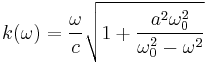 k(\omega) = \frac{\omega}{c} \sqrt{1%2B\frac{a^2 \omega_0^2}{\omega_0^2-\omega^2}}