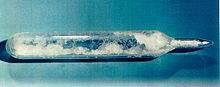 Snow-like substance in a sealed glass ampoule.