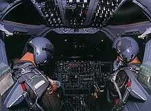 The interior of a B-1B cockpit at night