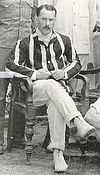 picture of Charles Lyon seated wearing cricket flannels and a blazer.  Picture taken in India in 1908.