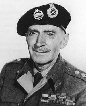 Black and white photograph of a middle aged man dressed in British Army uniform