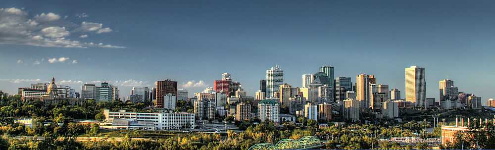 Panorama of Edmonton's skyline taken on a fall day showing the decommissioned EPCOR's Rossdale Power Plant and the Walterdale Bridge.