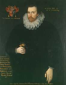 A three-quarter portrait of a white man, dressed entirely in black with a white lace ruff.  He has brown hair, a short beard and moustache, and a neutral expression.  Latin text surrounds the image.