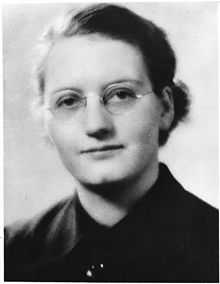 A young woman in glasses