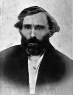 black-and-white photo of Eugene Skinner, a bearded man