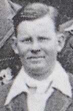 Close up of young, dark-haired man.