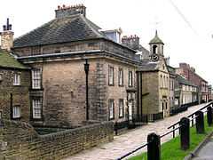 A row of stone houses and buildings