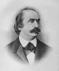 A balding white man aged about 40 with a moustache