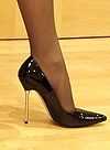 A foot in a black high-heeled shoe