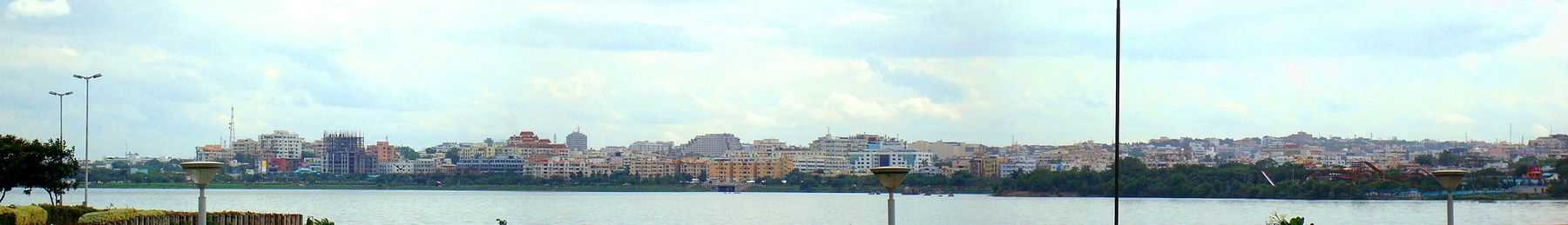 a view of buildings along located on the banks of lake