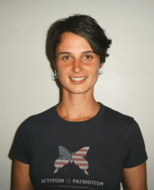 Photo of white brunette woman with black shirt.