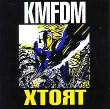 On a dark background, the word KMFDM in white capital letters at the top, and XTORT in capital yellow letters at the bottom. In the center is an image of a man flying directly up and towards the viewer, with stylized explosions and a sunburst in the background. It is done in a woodcut style, with angular, blocky textures, and uses a simple pattern of blue, yellow, white and black.