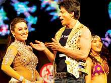 Rani Mukerji and Shahrukh Khan are seen dancing on stage