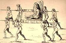 An antique line drawing of a man with a feather crown being carried by eight nearly naked carriers