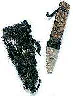 A knife made from stone, and a woven sheath