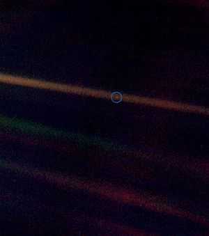 Pale blue dot image with a wider field of view to show more background