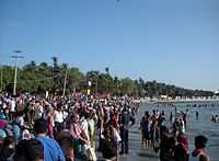 People taking dip in the shores of Bay of Bengal.