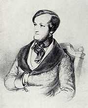 The head and upper body of a young white man with dark hair receding where it is parted on the left. Sideburns run the full length of his face. He wears a cravat and his right hand is tucked between the buttons of his coat.