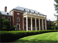 Building with central cupola and wings with Greek-style columns