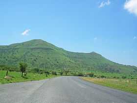 A steep green hill.