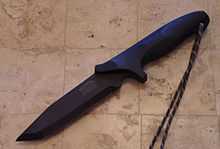 A black tanto bladed fighting knife.