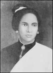 A black and white image of an Acehnese woman with her hair in a bun