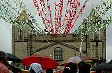 San Roque Church in barangay Mabolo with many parishioners attending a day mass.